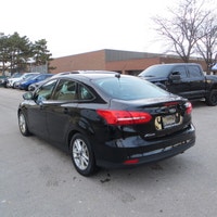 This 2016 Ford Focus SE is a reliable sedan with a sleek black exterior and a stylish charcoal inter... (image 6)