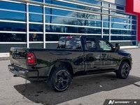 Odometer is 12404 kilometers below market average! Diamond Black Crystal Pearlcoat 2025 Ram 1500 Tra... (image 5)