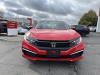 The 2021 Honda Civic Sedan LX in vibrant Rallye Red is your reliable and stylish companion for daily... (image 1)