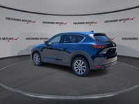 Finished in blue with a black interior, this used 2021 Mazda CX-5 GT AWD brings together upscale com... (image 5)