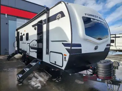 Forest River Grand Surveyor travel trailer 253RLS highlights: Fireplace Custom King Bed U-Dinette La...