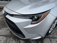 This 2022 Toyota Corolla LE is ready for action from every angle. Sleek J-shaped bi-beam LED headlam... (image 5)