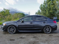 Feel the thrill of the road with the 2017 Subaru WRX STI Sport, finished in a striking shade of gray... (image 6)
