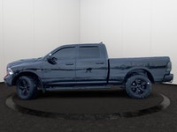 This Ram 1500 Classic has a powerful Regular Unleaded V-8 5.7 L/345 engine powering this Automatic t... (image 1)