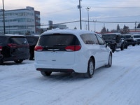 The 2026 Chrysler Grand Caravan SXT in Bright White with a Black interior offers a perfect balance o... (image 6)