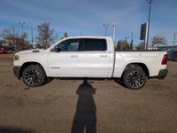 The 2026 Ram 1500 Longhorn Crew Cab in Ivory Tricoat Pearl combines rugged capability with refined l... (image 2)
