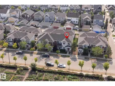 Set in one of the most desirable locations within Griesbach, this end-unit townhouse offers rare, un...