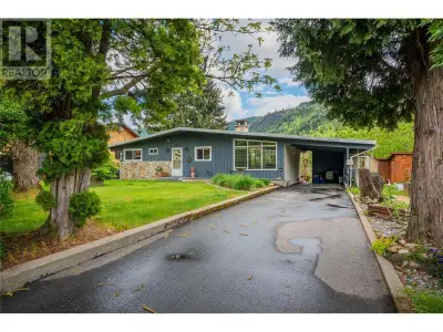 Perched gracefully on the banks of the Columbia River, this charming 4-bedroom rancher with basement...
