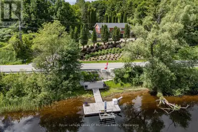 Overlooking the Muskoka River and just a short drive from town amenities, this brick home offers a f...