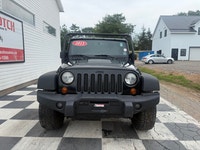 A rugged four-door SUV with iconic styling, manual transmission, and strong 4x4 capability, offering... (image 1)