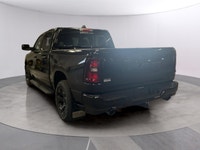 The 2026 Ram 1500 Express 4x4 Crew Cab 57 Box is a powerful yet stylish black truck thats ready for... (image 2)