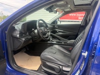 A stylish compact sedan with a modern interior, advanced technology, and efficient performance, offe... (image 8)