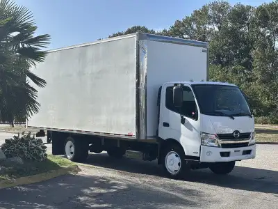 This 2018 Hino 195 is a commercial cube van powered by a 5.1L four-cylinder diesel engine paired wit...