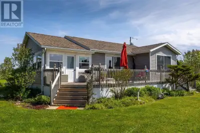 With the Northumberland Strait as your backdrop, the Wood Islands Ferry crossing the view, and beach...