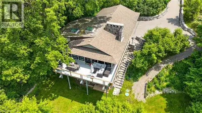 Attention commuters! Exceptional one-of-a-kind custom-built residence, tucked away in a truly privat...