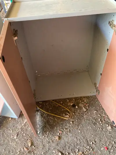 2 metal cabinets with brown doors .. measures 12" deep x 24" wid, View more