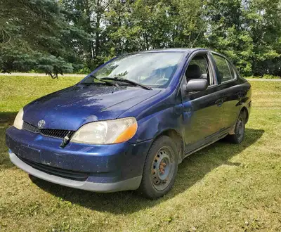 This dark blue 2001 Toyota Echo 4 door sedan is a proven workhorse that's easy on gas and built to l...