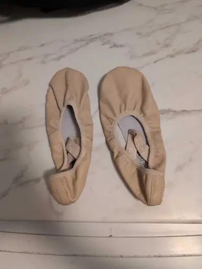 These are a pair of gently used Capezio Lily 212W ballet slippers, size US 5 WW (EU 35.5 WW, UK 3 WW...