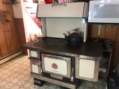 This antique IRON DUKE woodstove/cookstove was produced by the Enterprise Foundry in Sackville New B...