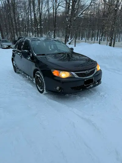 2009 Subaru Impreza Sport Hatchback AWD 2.5L, 5 speed manual Heated seats, sunroof, CarPlay stereo w...