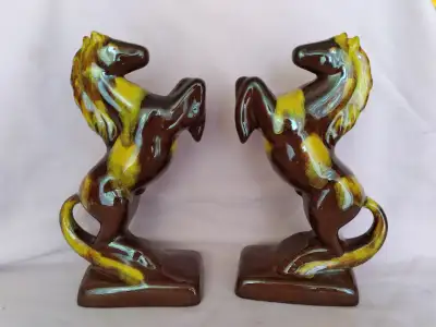 Nice, vintage Circa 1980's Blue Mountain Pottery brown and beige horses made as bookends. Both are i...