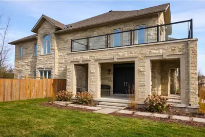 THIS ONE WON'T LAST! Stunning executive freehold end-unit townhome offering approximately 2,600 sq f...