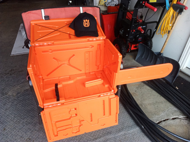 Husqvarna chainsaw carrying case and new cap in Outdoor Tools & Storage in Peterborough