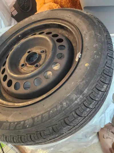 Like new set of Uniroyal Tiger Paw Touring All Season tires on rims: 175/65R15 84H