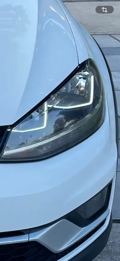Selling a driver-side (left) headlight assembly removed from a 2019 Volkswagen Golf Alltrack. The un...