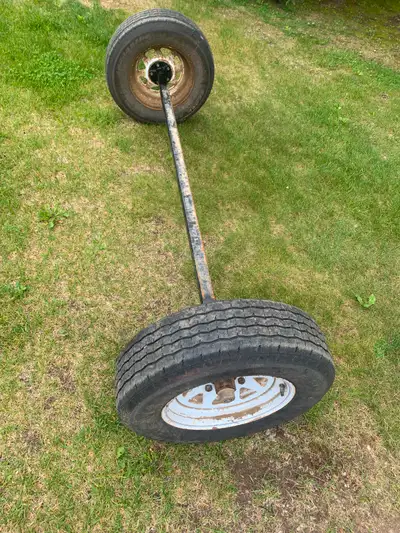 Complete trailer axle, 15 inch tires, rims new bearings 80 inches between hubs
