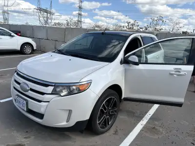 I am selling a used white Ford Edge, a reliable SUV known for its spacious interior and smooth ride....