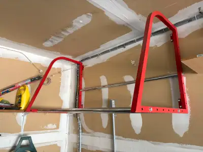 Heavy duty powder coated steel winter tire storage racks that screw to garage wall - big enough for...