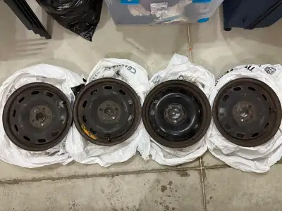 Set of four, moderately-used RSSW black steel rims (15x6", 5-100 bolt pattern, 36.5 mm offset, 57.3...