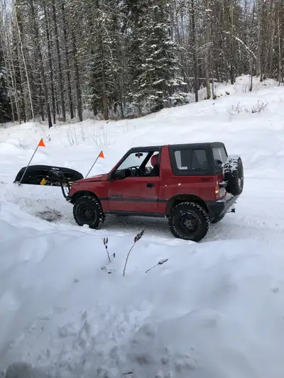 1991 Suzuki sidekick , with snow plow , brand new studded winters on it , have mud tires for it . Re...