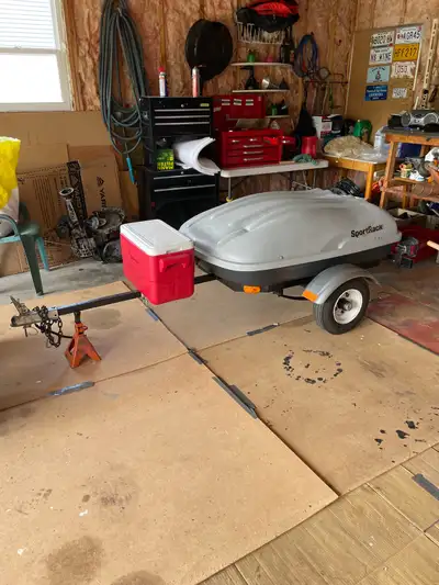 This SportRack utility trailer features a compact 4x4 design perfect for small cargo or light-duty t...