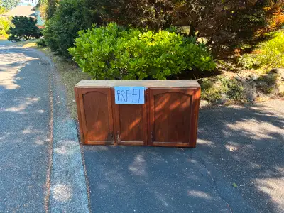 Solid wood cabinet. At end of driveway, pick up, take away. I will remove the post when the cabinet...