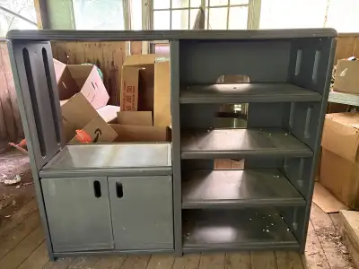 This sturdy plastic entertainment unit offers practical storage for organizing your media components...