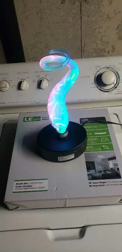 Illuminate your space with this used LED plasma lamp, featuring a mesmerizing swirl of colourful lig...