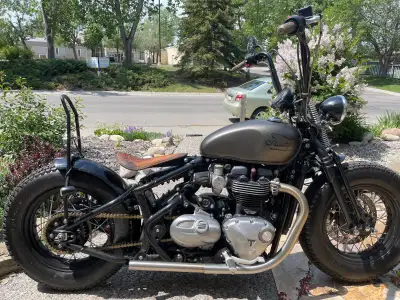Custom Triumph Bobber valued at over 32000.00 custom features: Springer Front End Cat Squasher Avon...