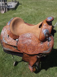 Beautiful hand tooled leather western show saddle with halters