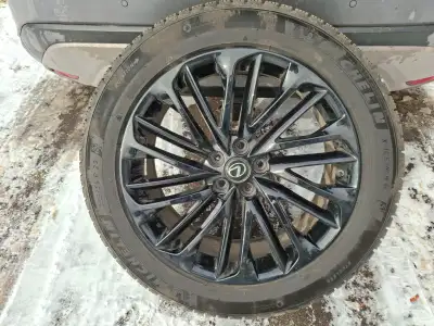 Almost new Michelin x ice tires and black gloss OEM Rims. Rims are over $600. Each new. No scratchs...