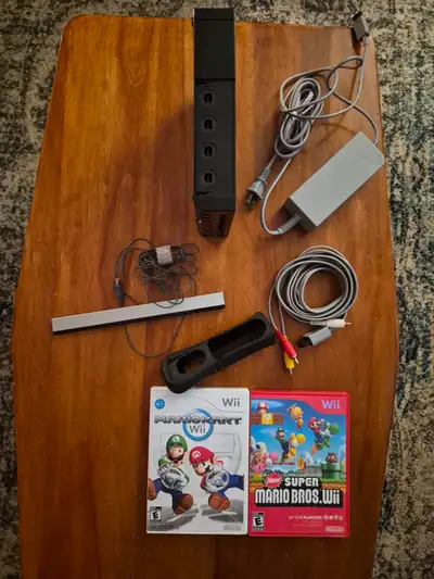 Selling my childhood Nintendo Wii missing remote***. All the wiring is included, as well as two clas...