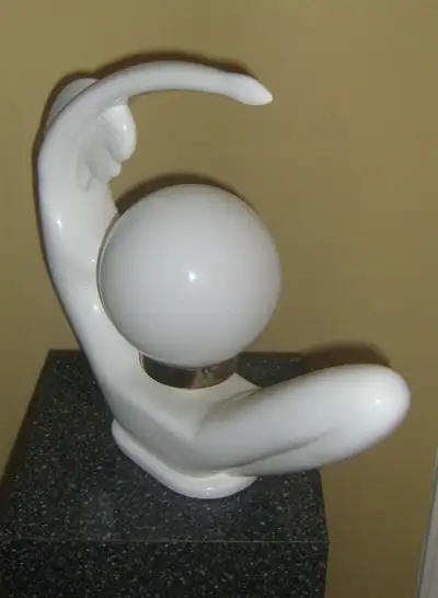 1970s art deco lamp is a sculpture style form of a nude woman figure. Featuring a milk white glazed...