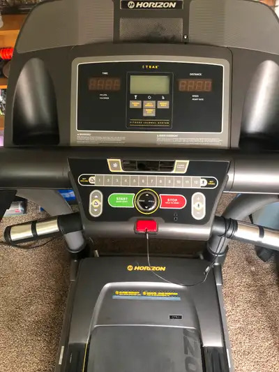 Horizon brand with adjustable incline, phone hook up , speakers, heart rate monitor, cooling fan, em...
