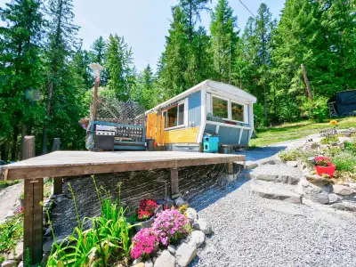 9.73 acres of treed mountain side with terraced areas all throughout. Mobile home with 2 bedrooms th...