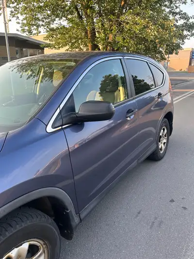 This reliable Honda CR-V is a dependable SUV, currently in used condition with visible wear on the w...