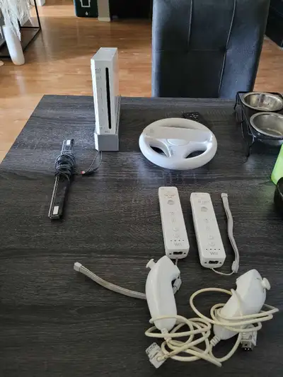 Nintendo wii with 2 controllers 1 steering wheel No power cable 40 obo