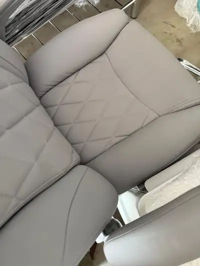 This brand new grey office chair offers superior comfort and support, perfect for long workdays. Wit...