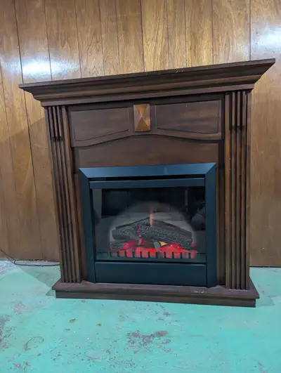 Dimplex electric firebox / mantel package. Dark wood finish, firebox operates with and without heate...