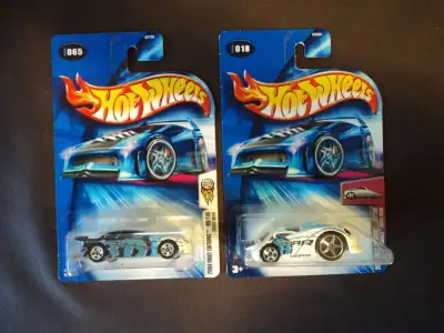 This lot includes a white Hardnoze Dodge Neon (#18) and a black with blue and white Dodge Neon (#65)...